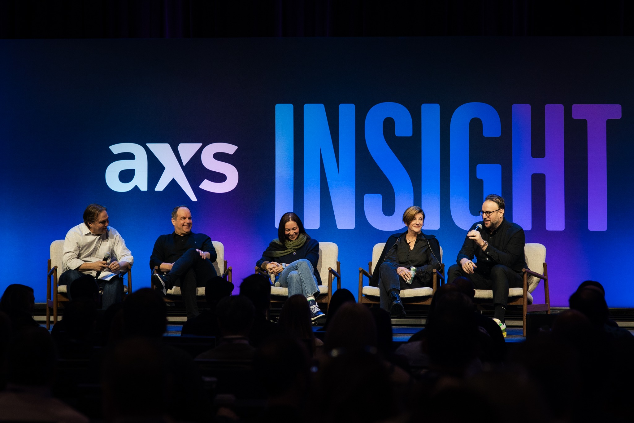 Speakers and an audience at the AXS Insight conference